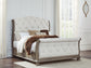 Ardenfield Queen Upholstered Sleigh Bed with Mirrored Dresser